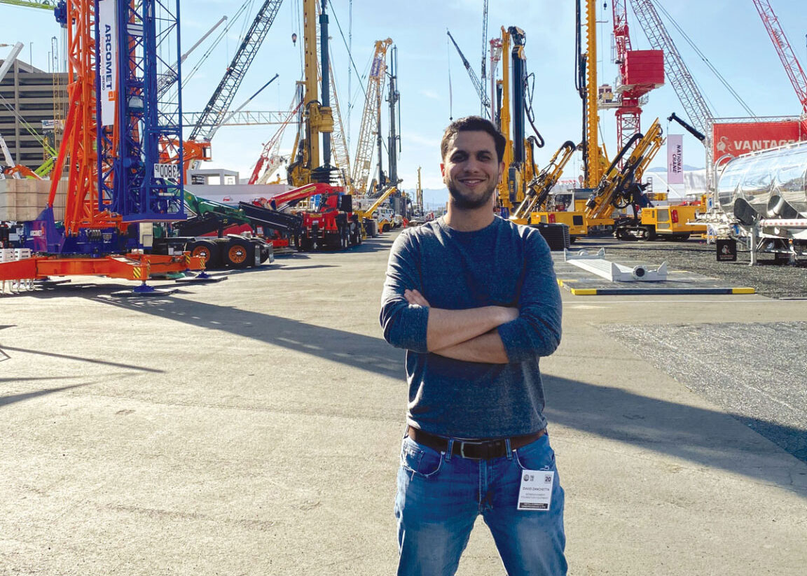 David Zanchetta posing in front of heavy machinery