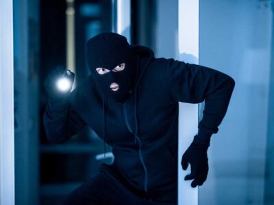 Robber with flashing sneaking about