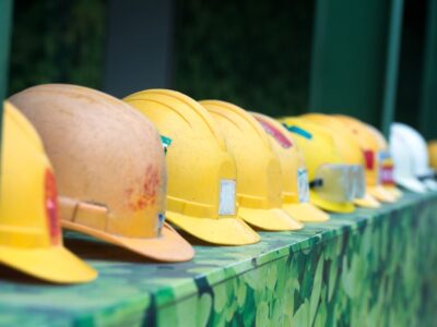 Hardhats lined up in a row.