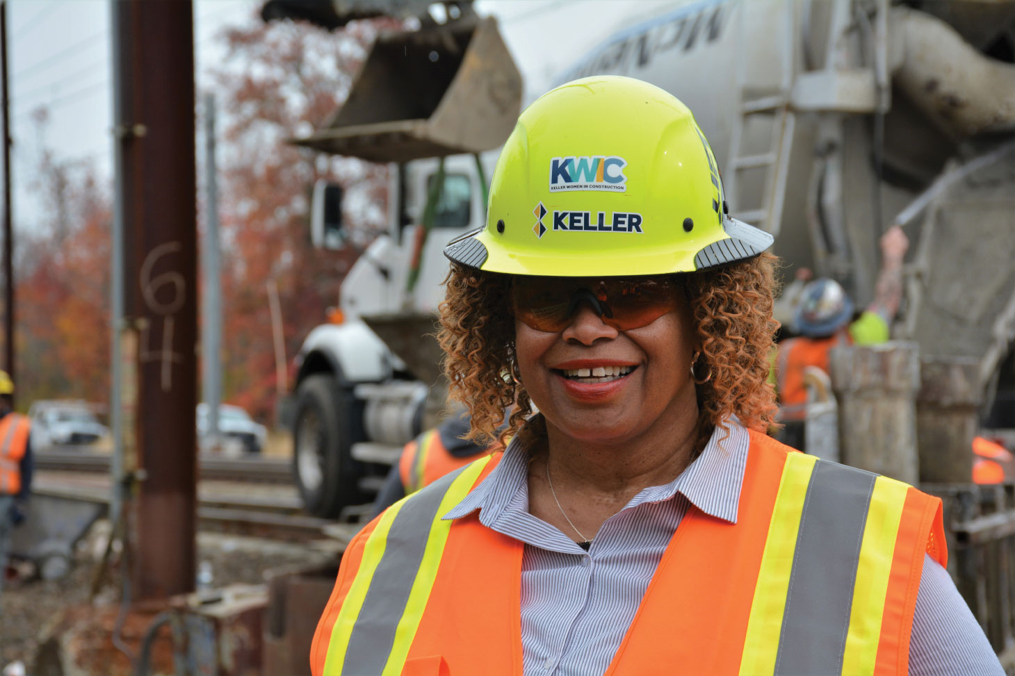 Jo-’Anthion Harris smiling for camera wearing safety hat, glasses and vest