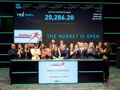 Women in Governance with John McKenzie pushing button on table on table