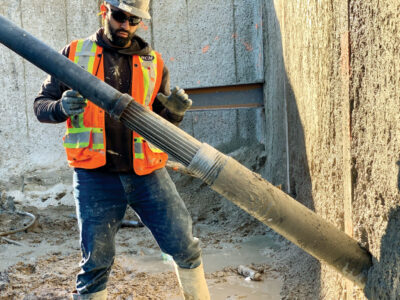 Construction working standing behind Expander Body