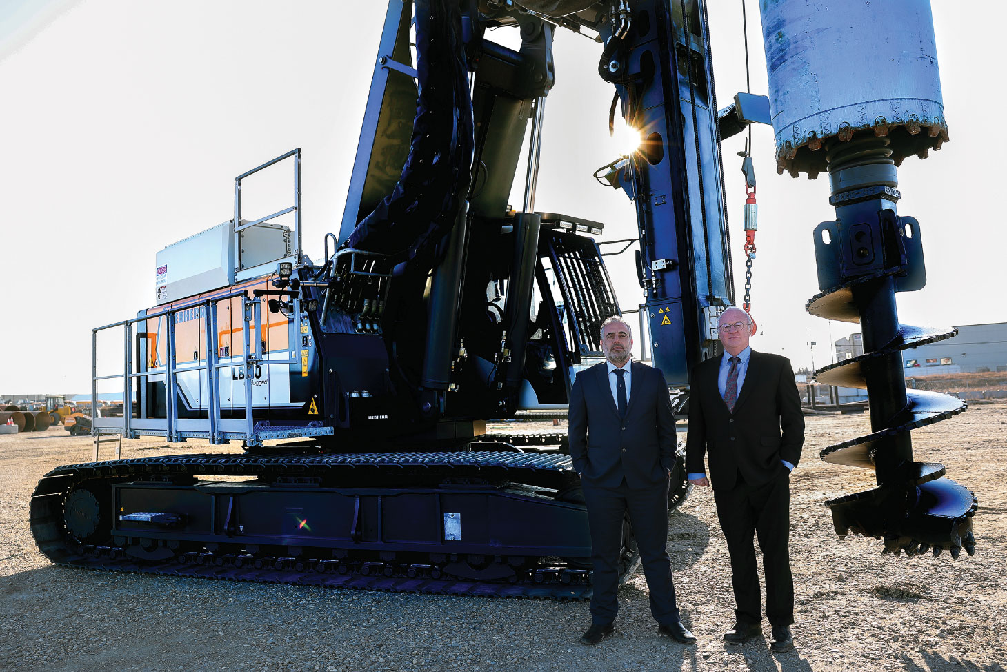 Gordon Williamson and Nixar Abou Ltaif standing in front of Liebherr LB 30 unplugged