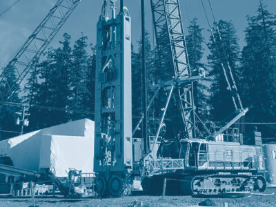 Photo of Pile driving equipment with blue tint overlay