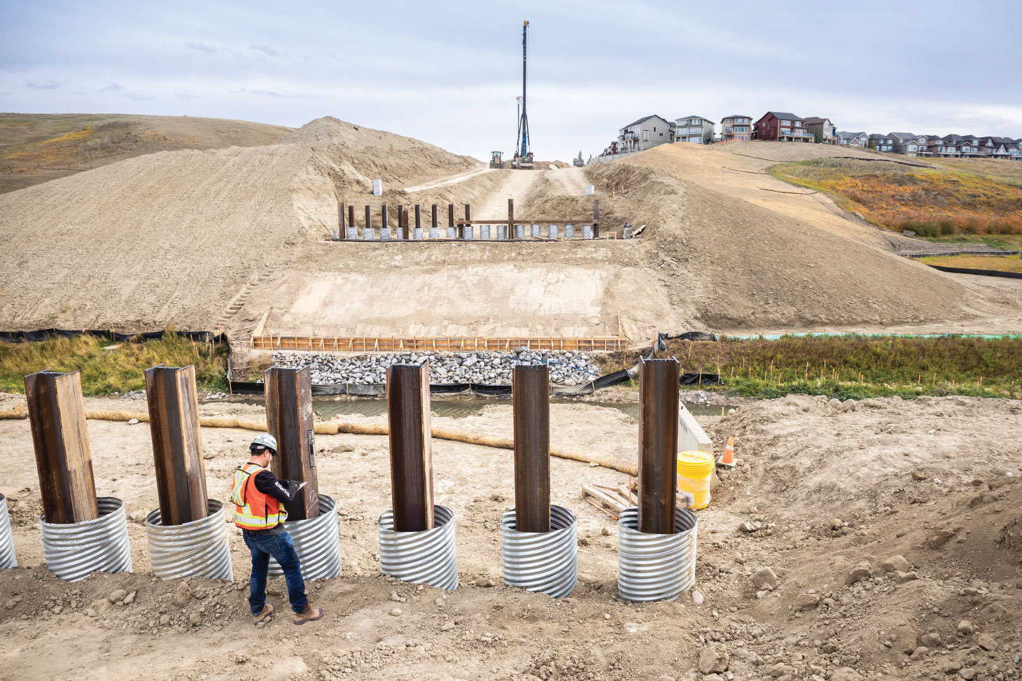 View of pile installation with housing in background