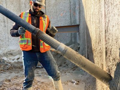 Worker installing Expander Body tieback