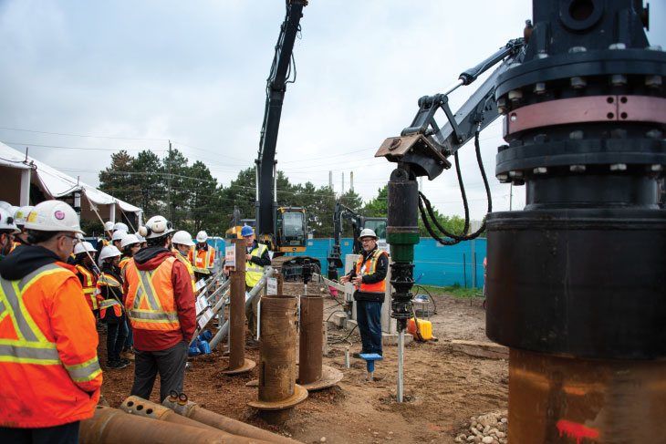 Dino chatting to group on construction site