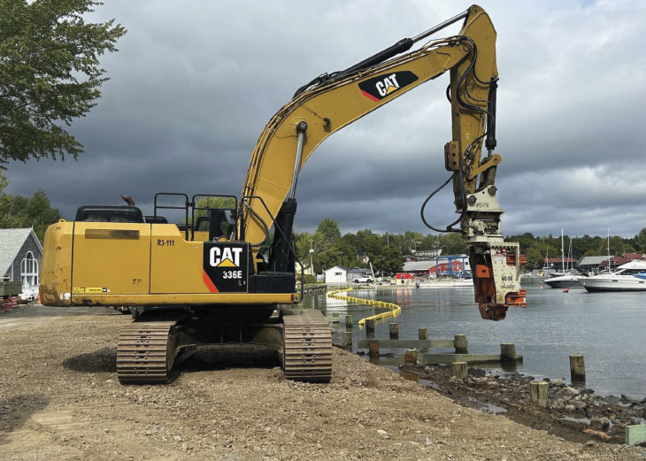 CAT 336 excavator on shoreline