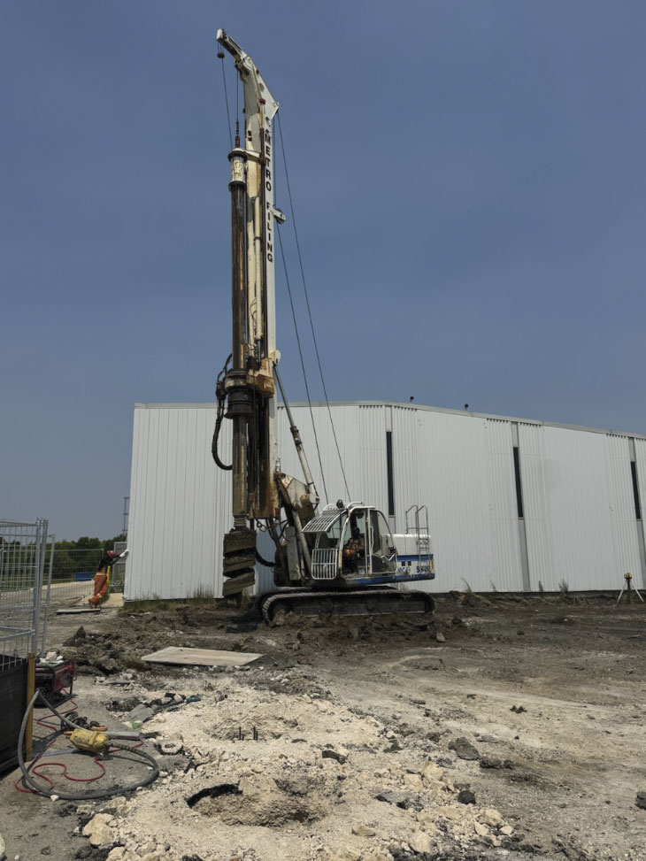 Pile driver sitting idle on jobsite