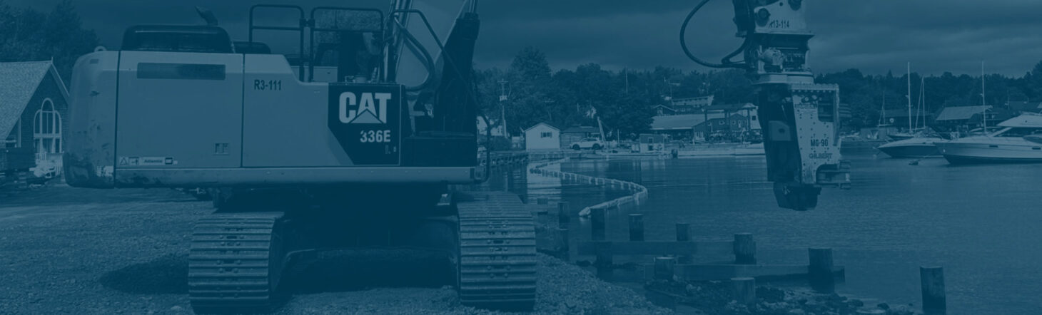 CAT 336 excavator on shoreline