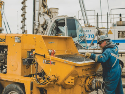 Man working on large piece of equipment