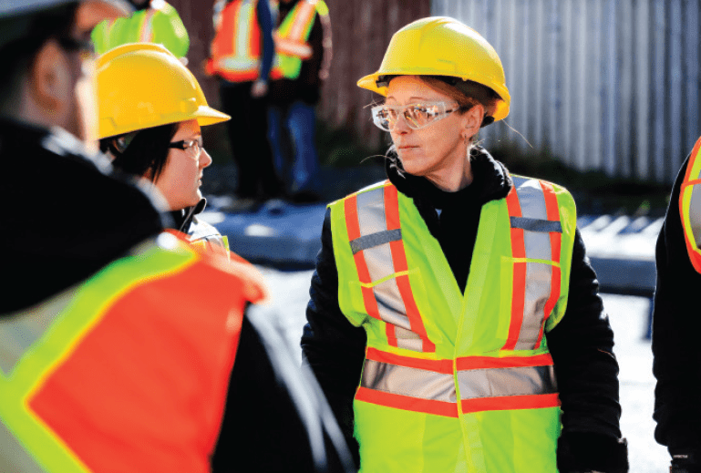 Women wearing PPE on construction site