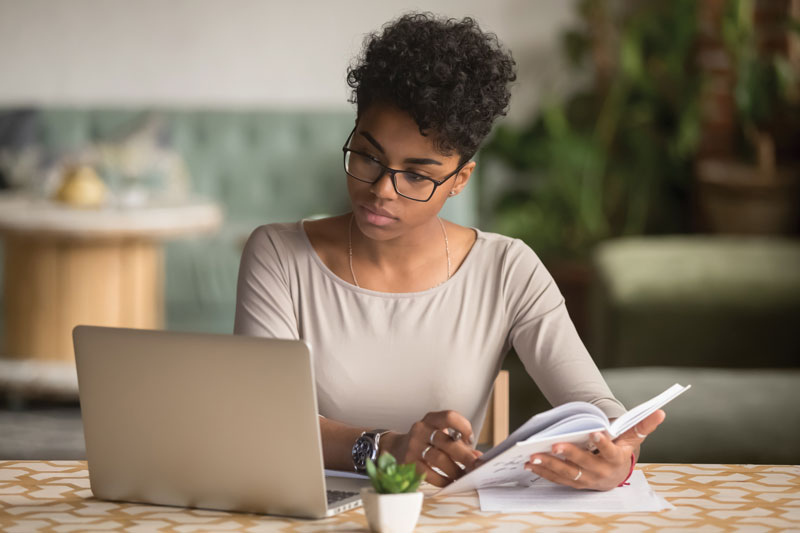 Woman at desk with laptop