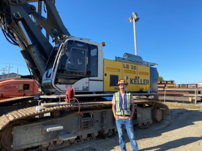 Steve Klein standing in front of heavy machinery