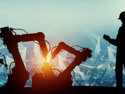 Digital illustration of automated machinery working on equipment with man in construction gear monitoring a tablet