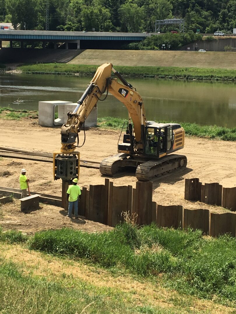 Operating machinery to install sheet piles.