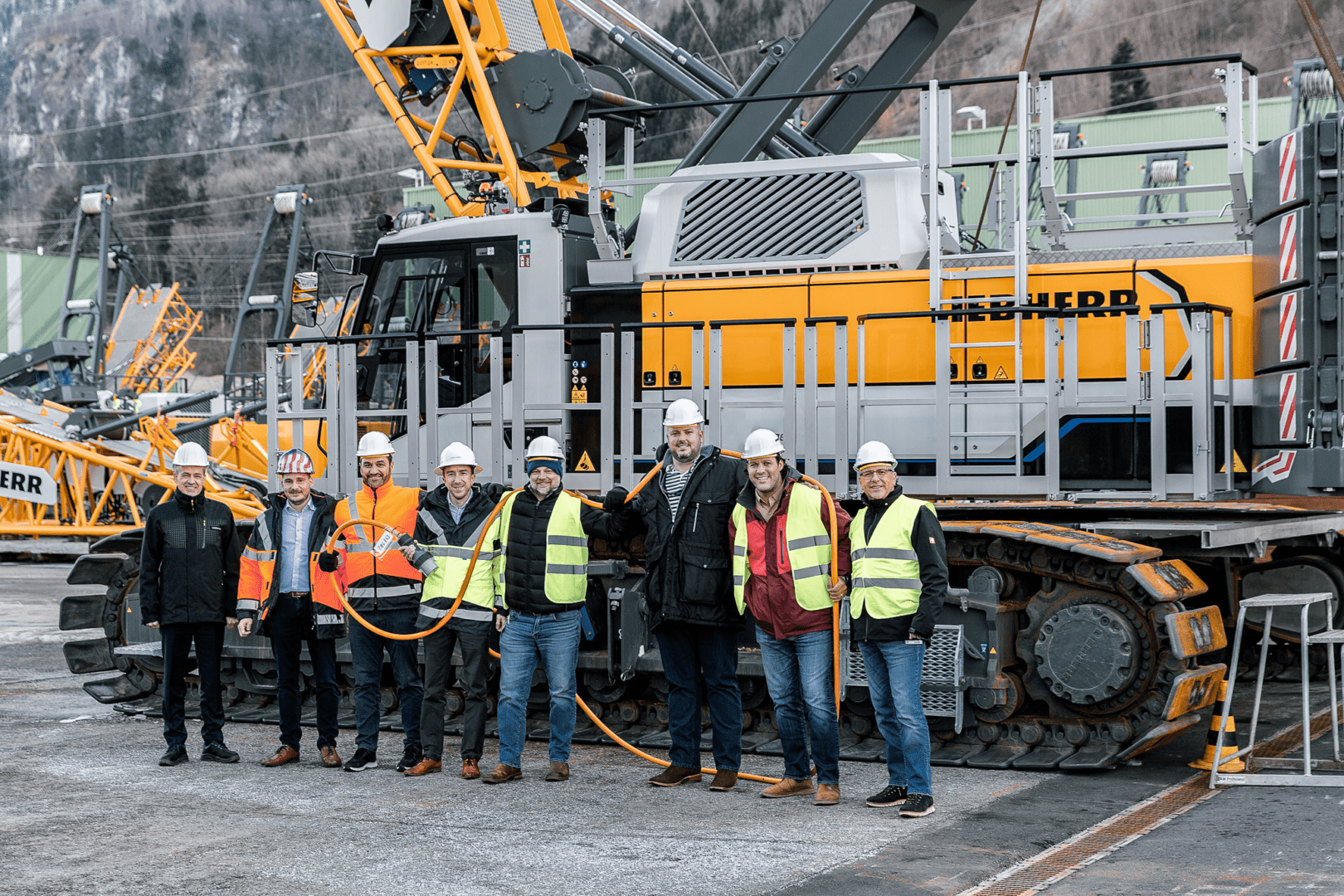 Team posing in front of Leibherr LR 1250.1 Unplugged