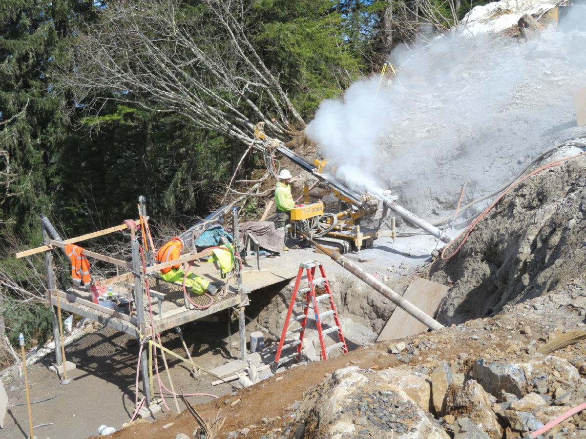 Scaffolding and workers drilling micropiles