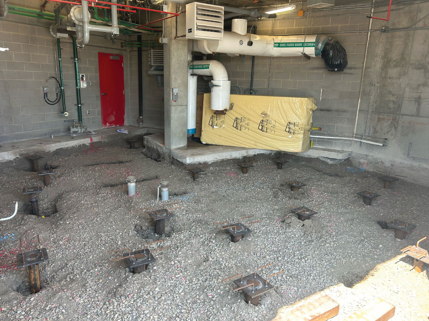 Helical Piles in floor at Centennial Arena