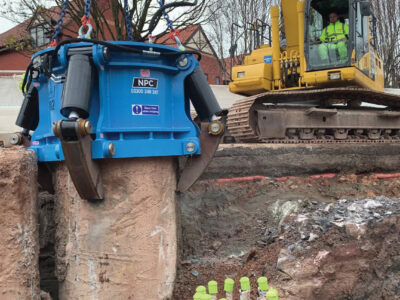 Quad XXL in foreground with large machinery in background