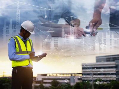Photo montage of construction worker with diagrams and illustrations in background