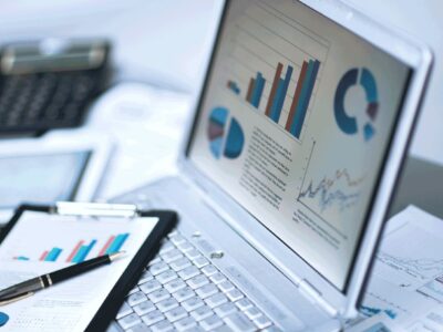 Laptop with charts and graphs onscreen