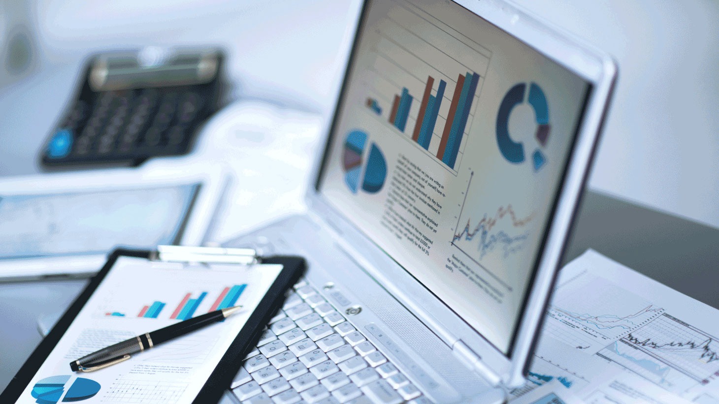 Laptop with charts and graphs onscreen