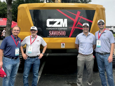 Group of four posing in front of SAVO500