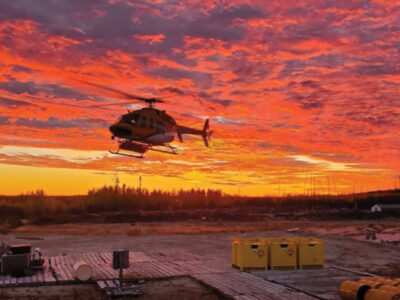 Helicopter lifting off against gorgeous sunrise