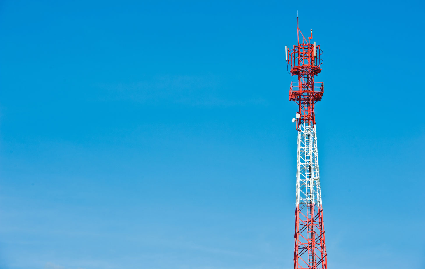 Telecommunication mast with sky background