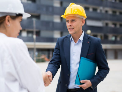 Developer and builder shaking hands