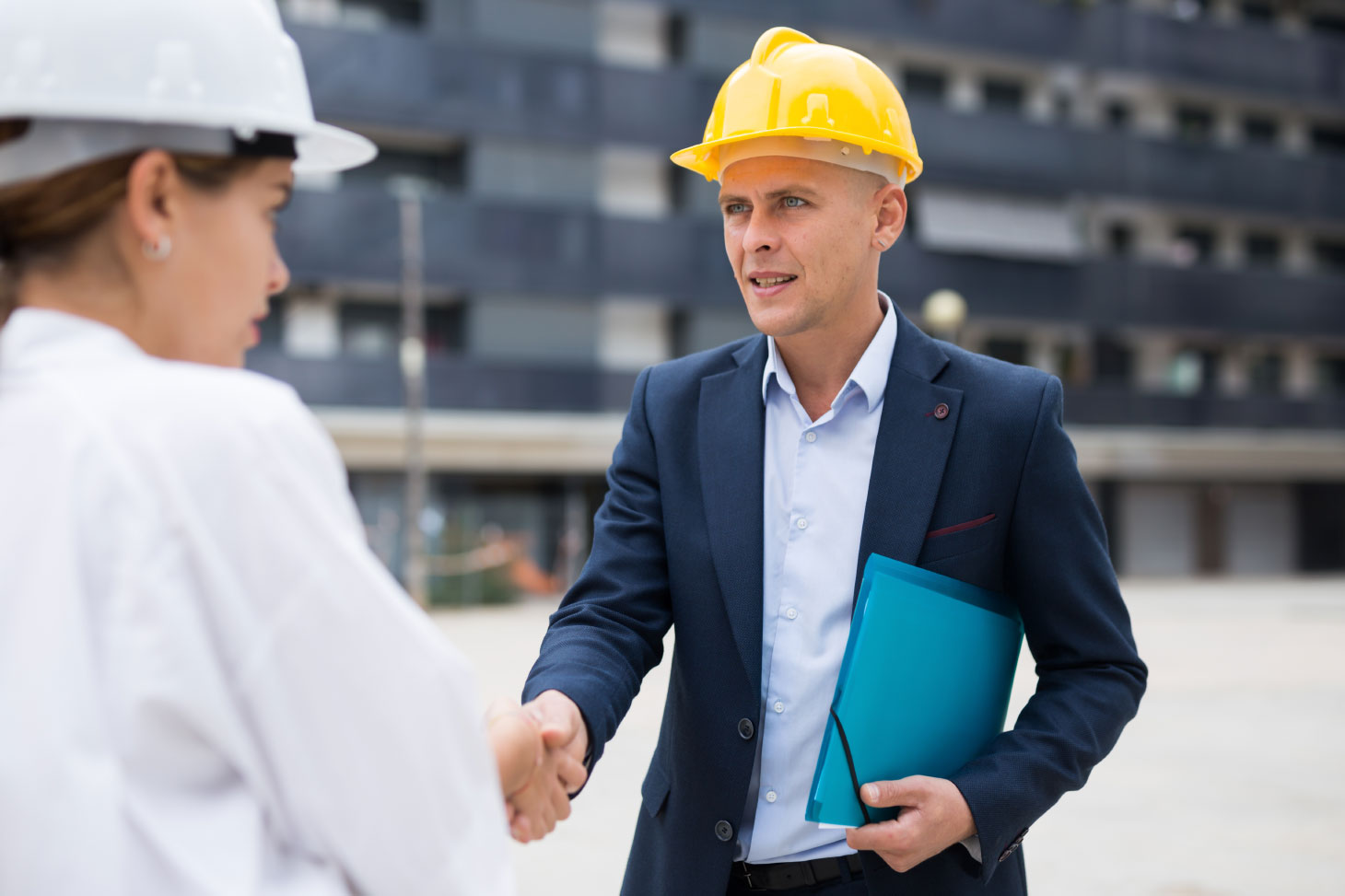 Developer and builder shaking hands