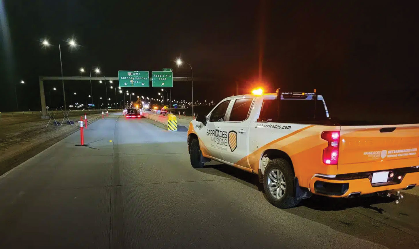 Barricades and Signs vehicle on construction site at night