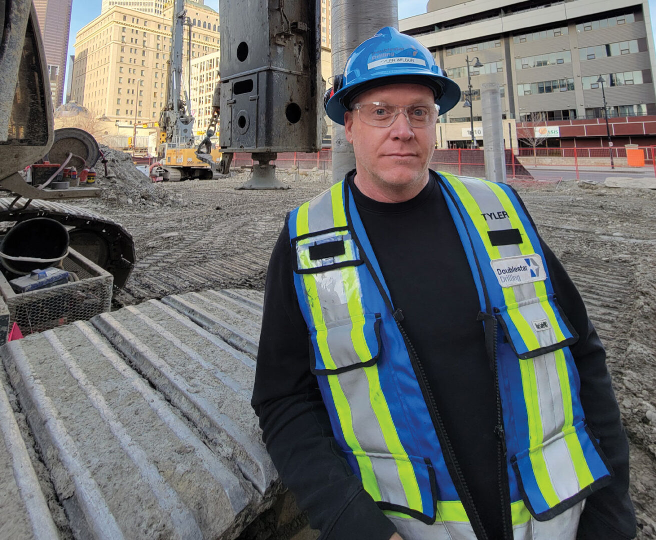 Tyler Wilbur on job site wearing PPE
