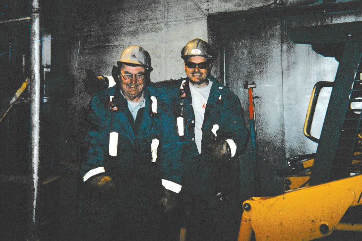 Vintage photo of Kevin and son on the job