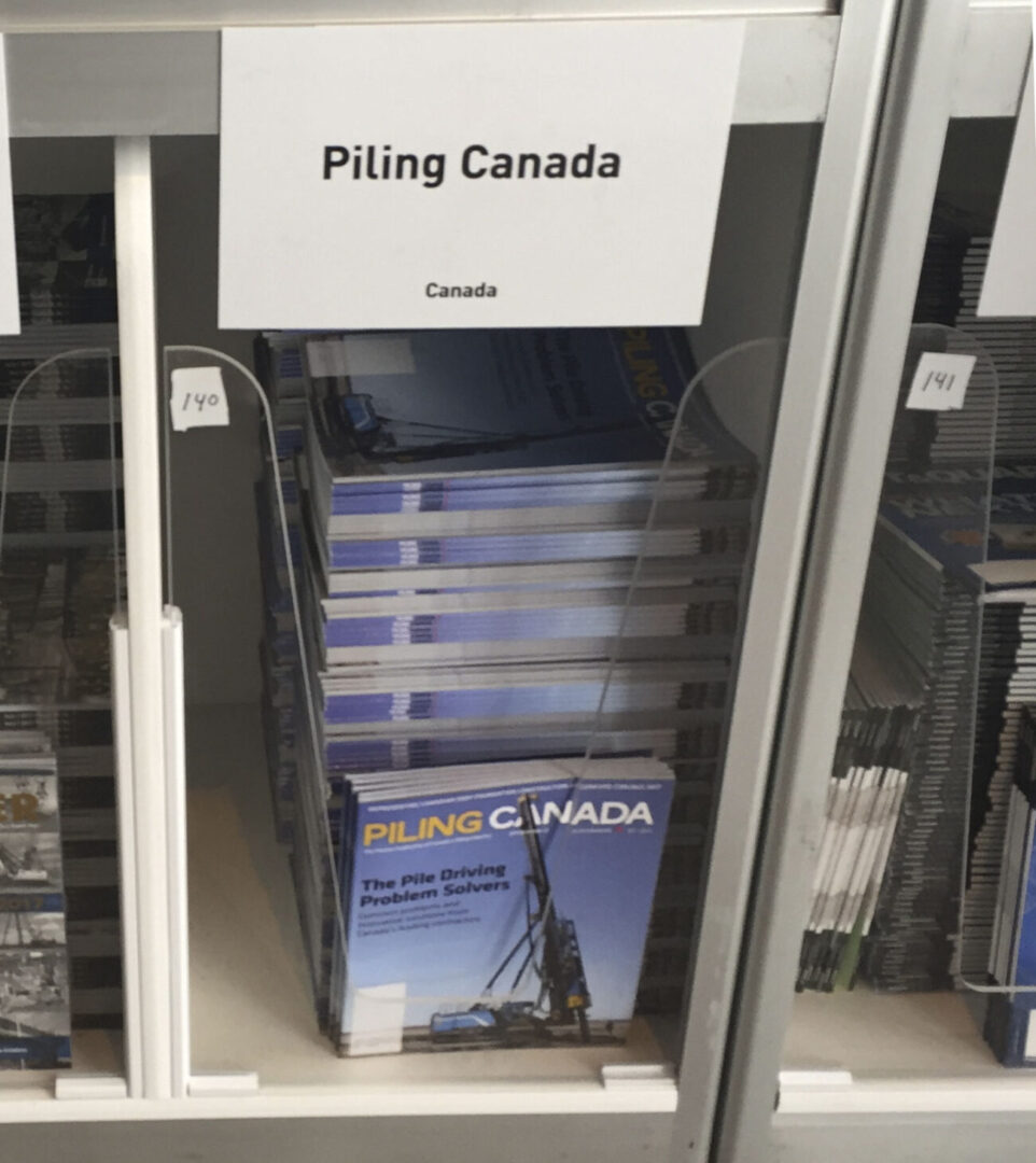Stack of Piling Canada magazines on a shelving unit