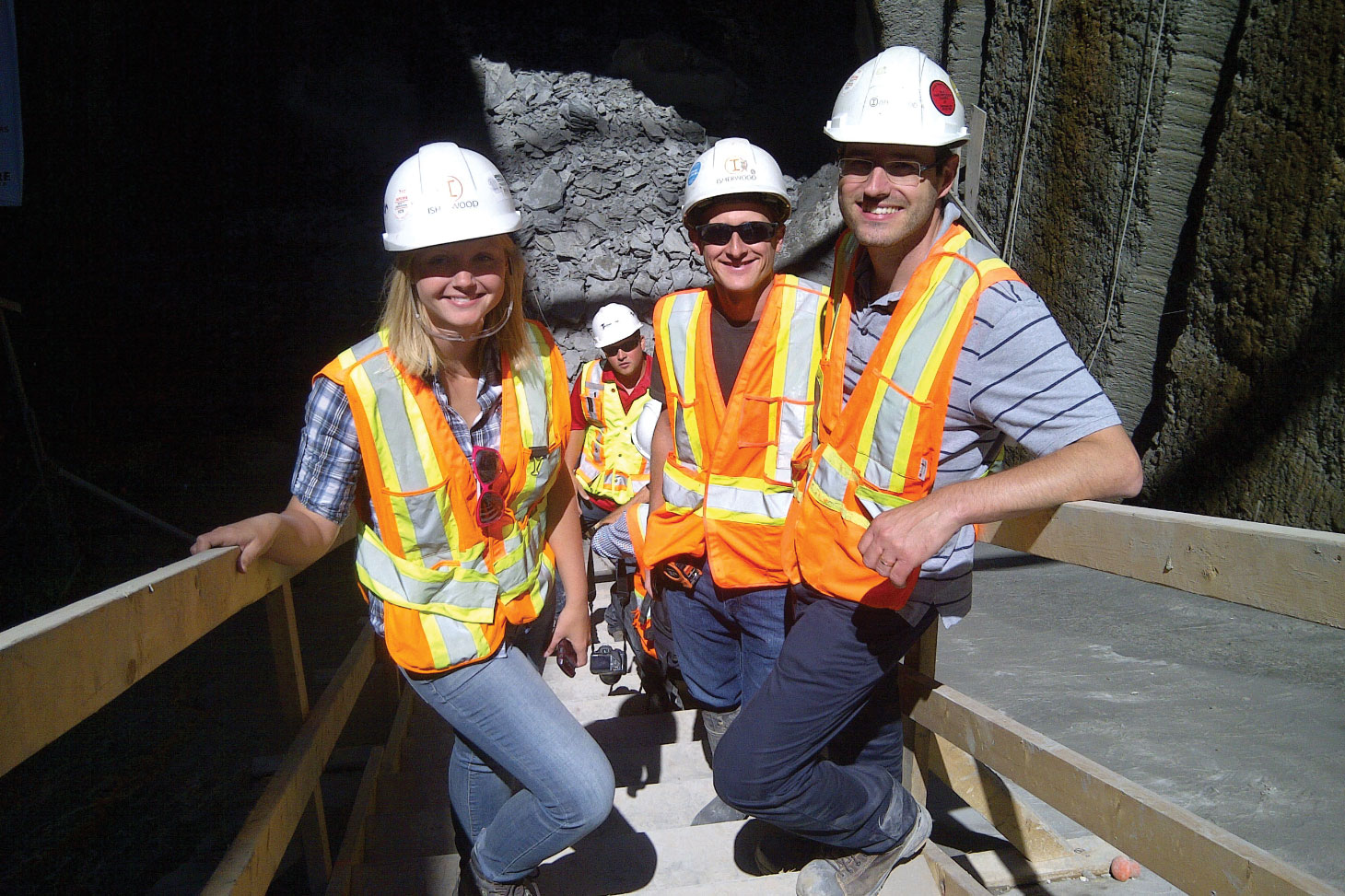 Shawna Munn and two others onsite, wearing safety equipment