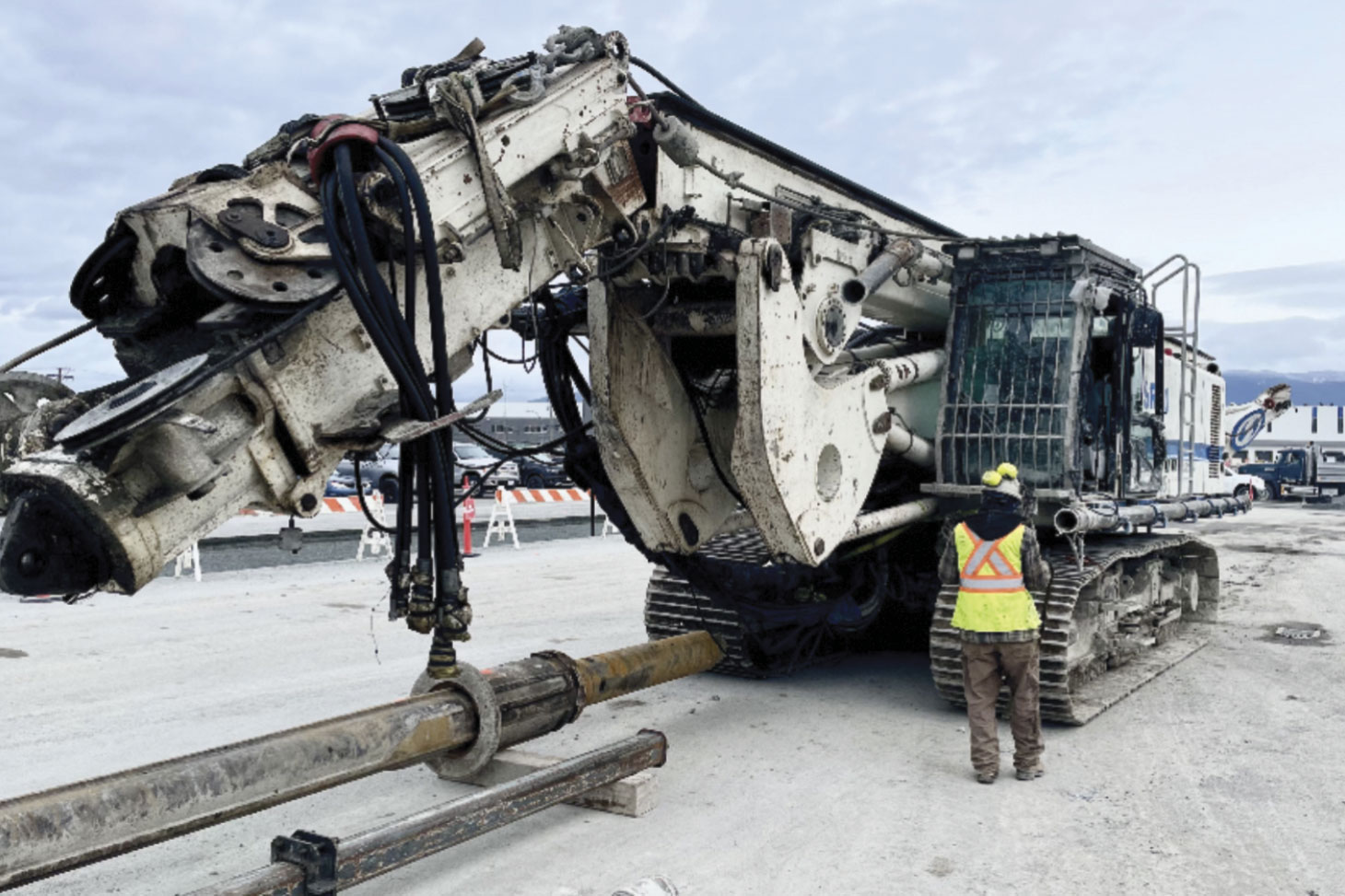 Jessica walking towards pile driving machine