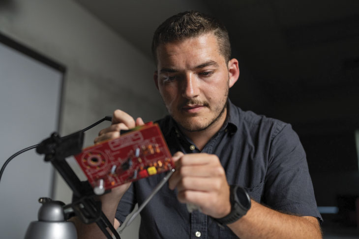 Student working on circuit board