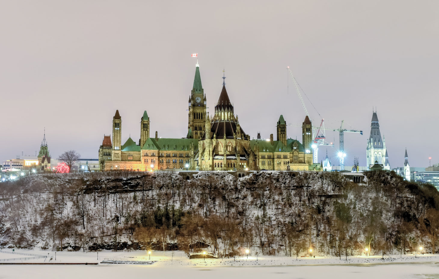 Parliament Hill and the Canadian House of Parliament in Ottawa, Canada during wintertime at night
