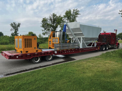 INTRIC grout plant and standalone hydraulic power pack on the back of a flatbed truck