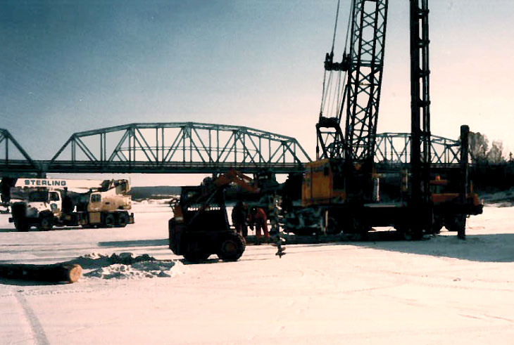 Predrilling through the ice