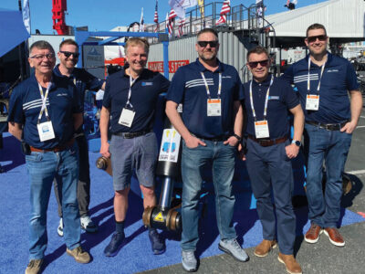 Group photo outside CONEXPO-CON/AGG