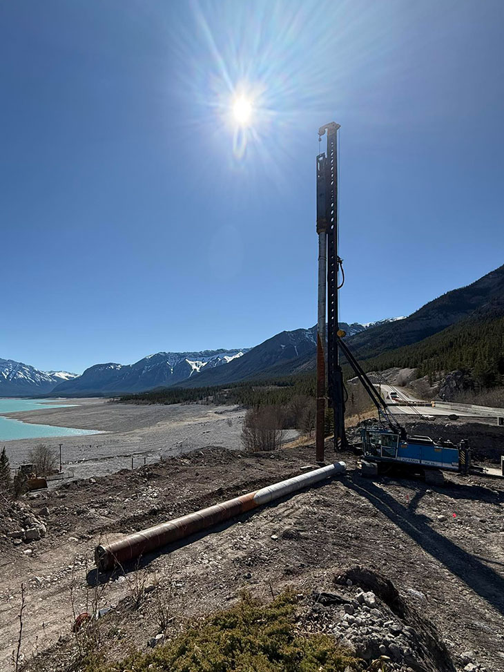 Junttan rig on construction site with Rocky Mountains in background