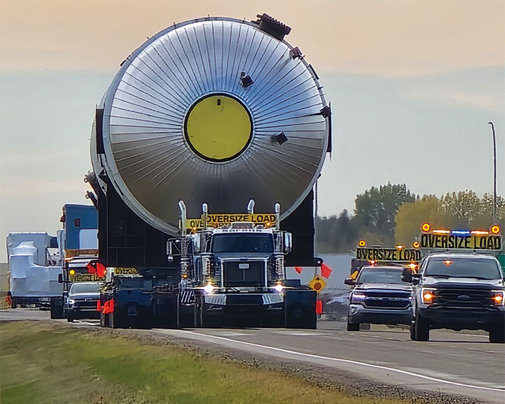 Oversized load being escorted along the highway