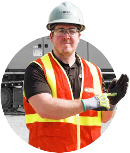 Man in safety gear demonstrating hand/arm signals
