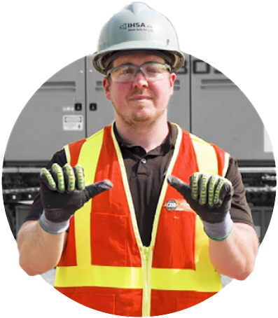 Man in safety gear demonstrating hand/arm signals