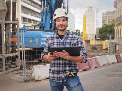 Construction worker holding tablet