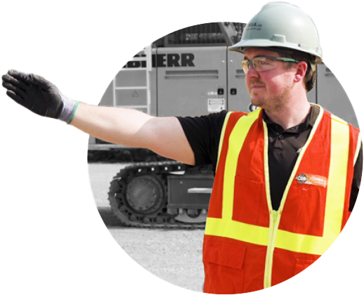 Man in safety gear demonstrating hand/arm signals