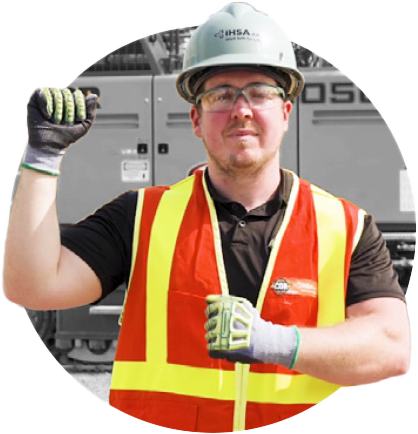Man in safety gear demonstrating hand/arm signals